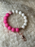 Pink and white wristlet