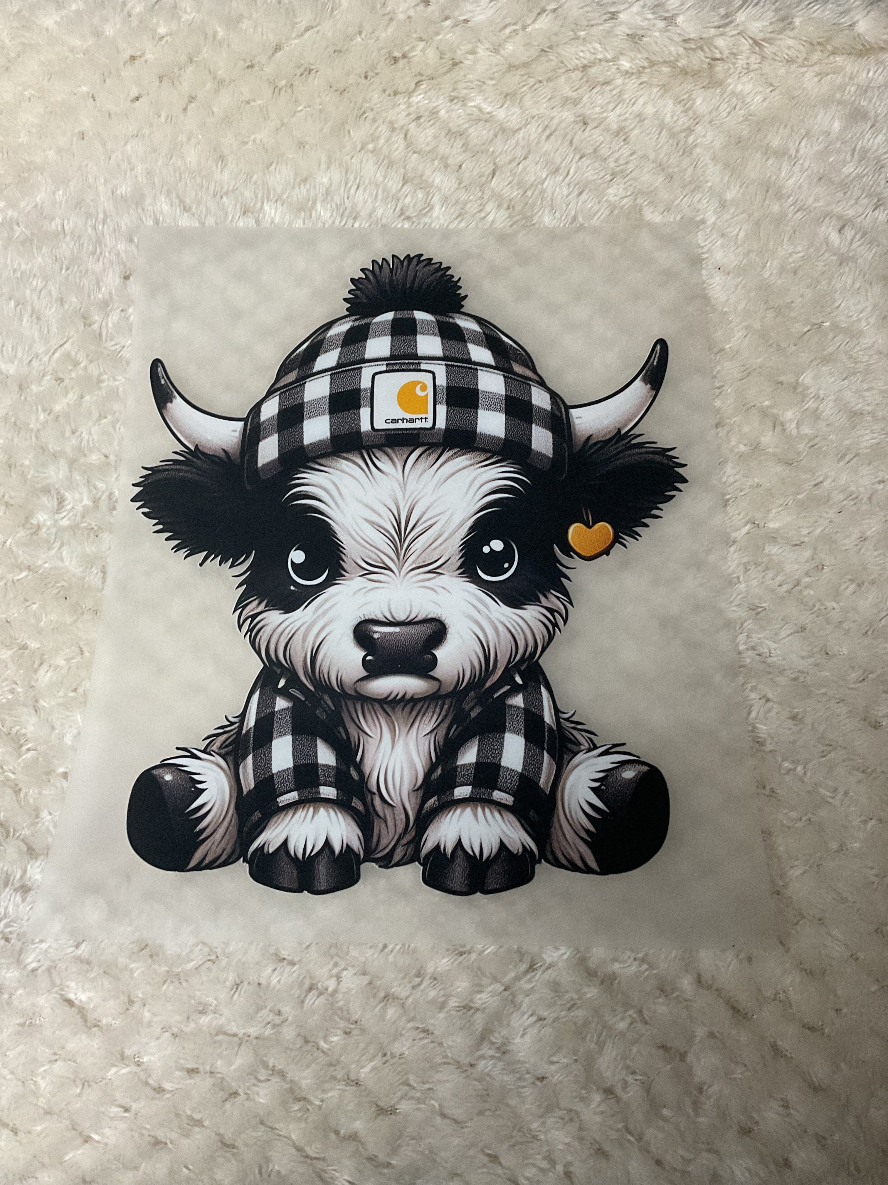 Black and white Highland cow with Carhartt beanie
