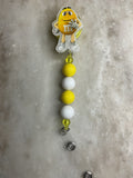 Yellow M&M badge reel