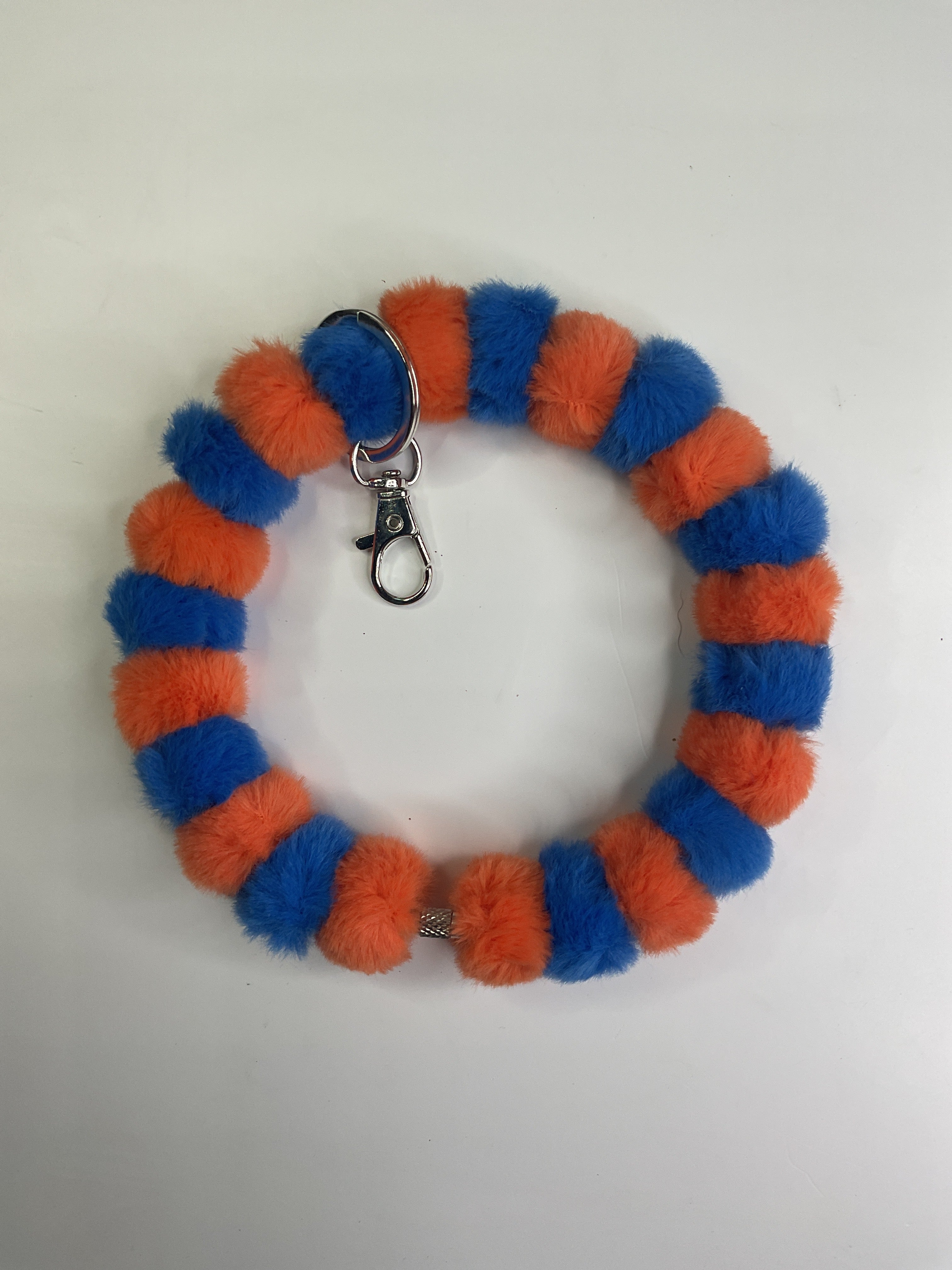 Orange and blue fuzzy wristlet