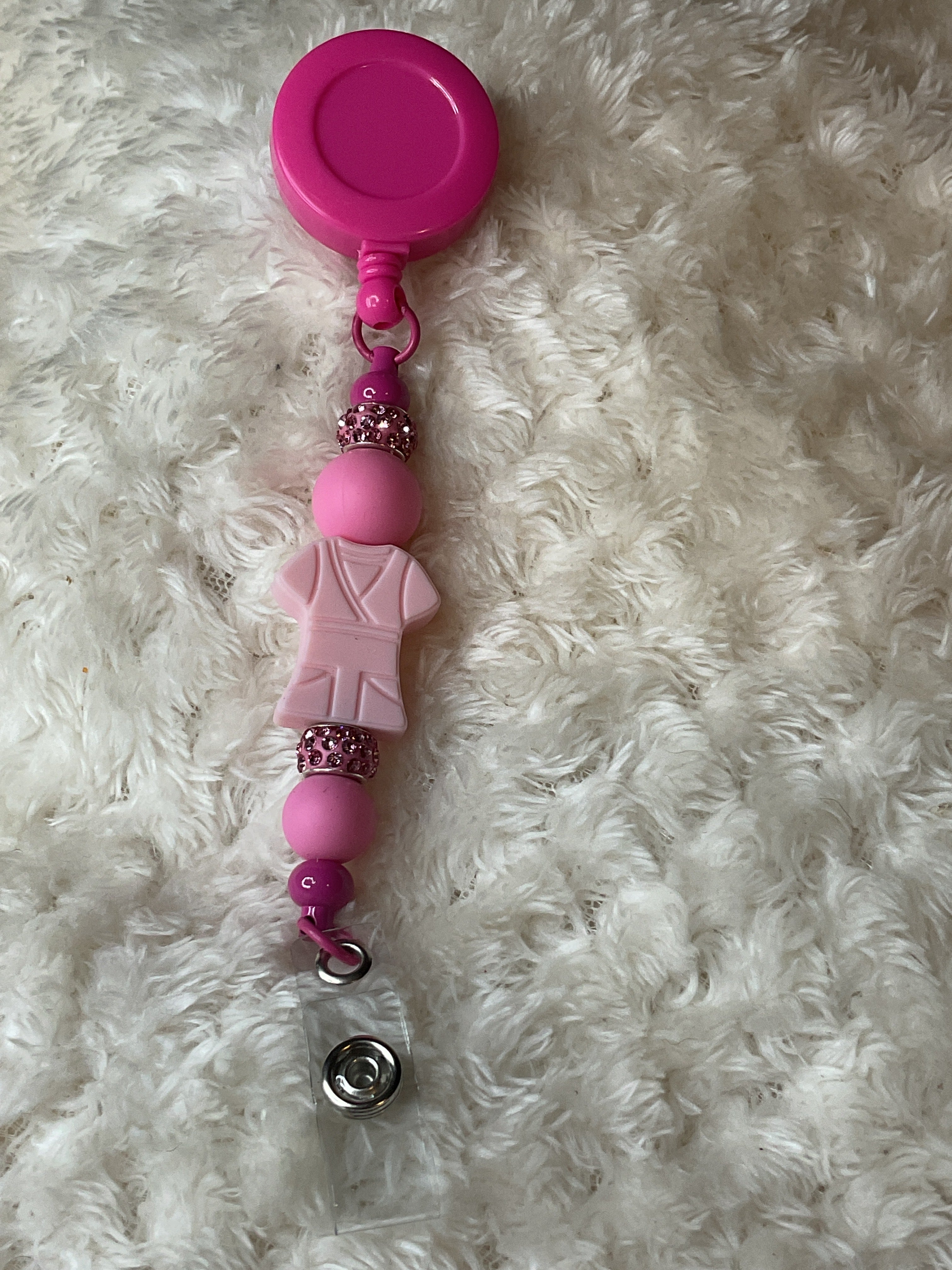 Pink scrub badge, reel