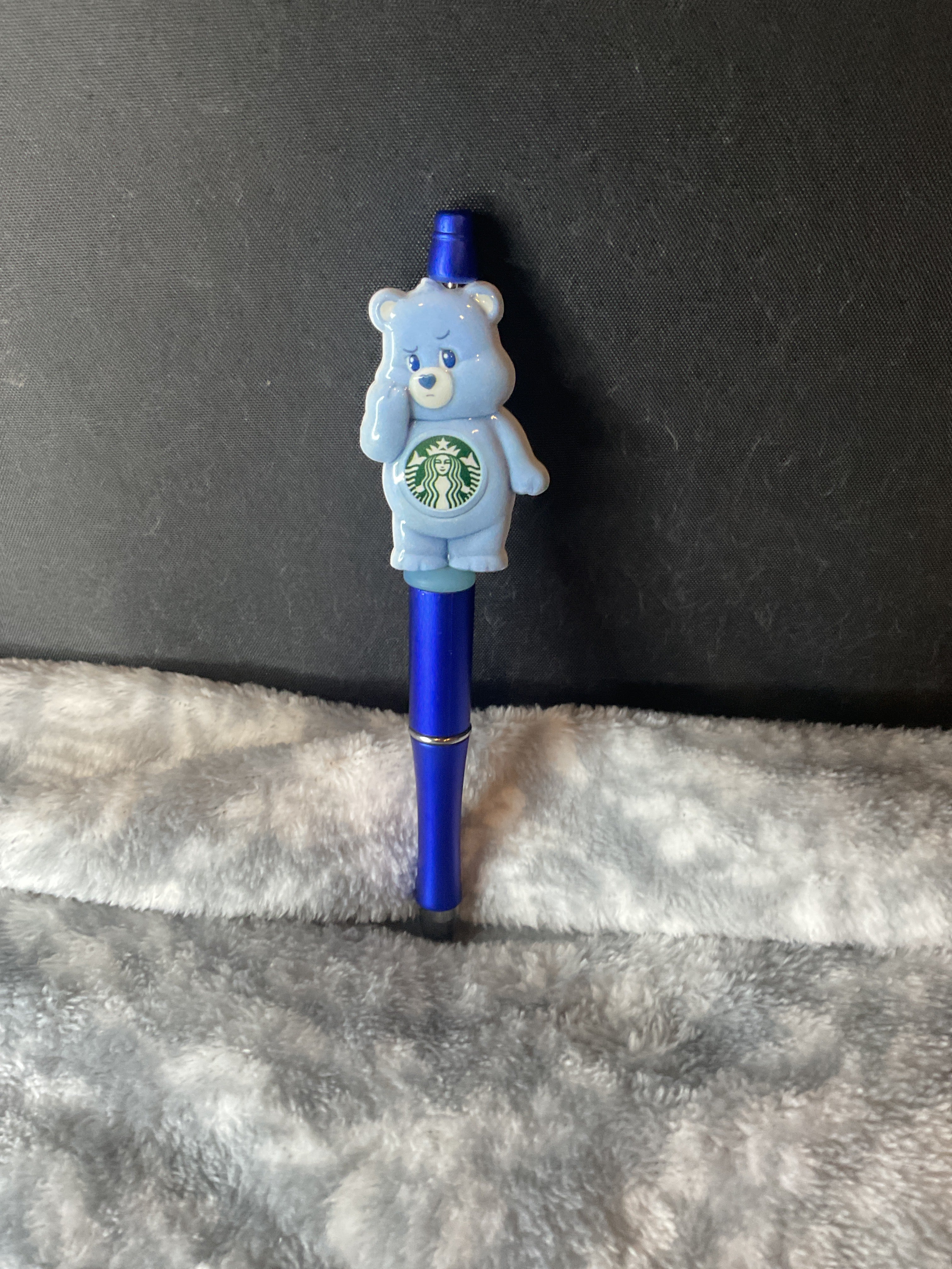 Blue bear on blue pen