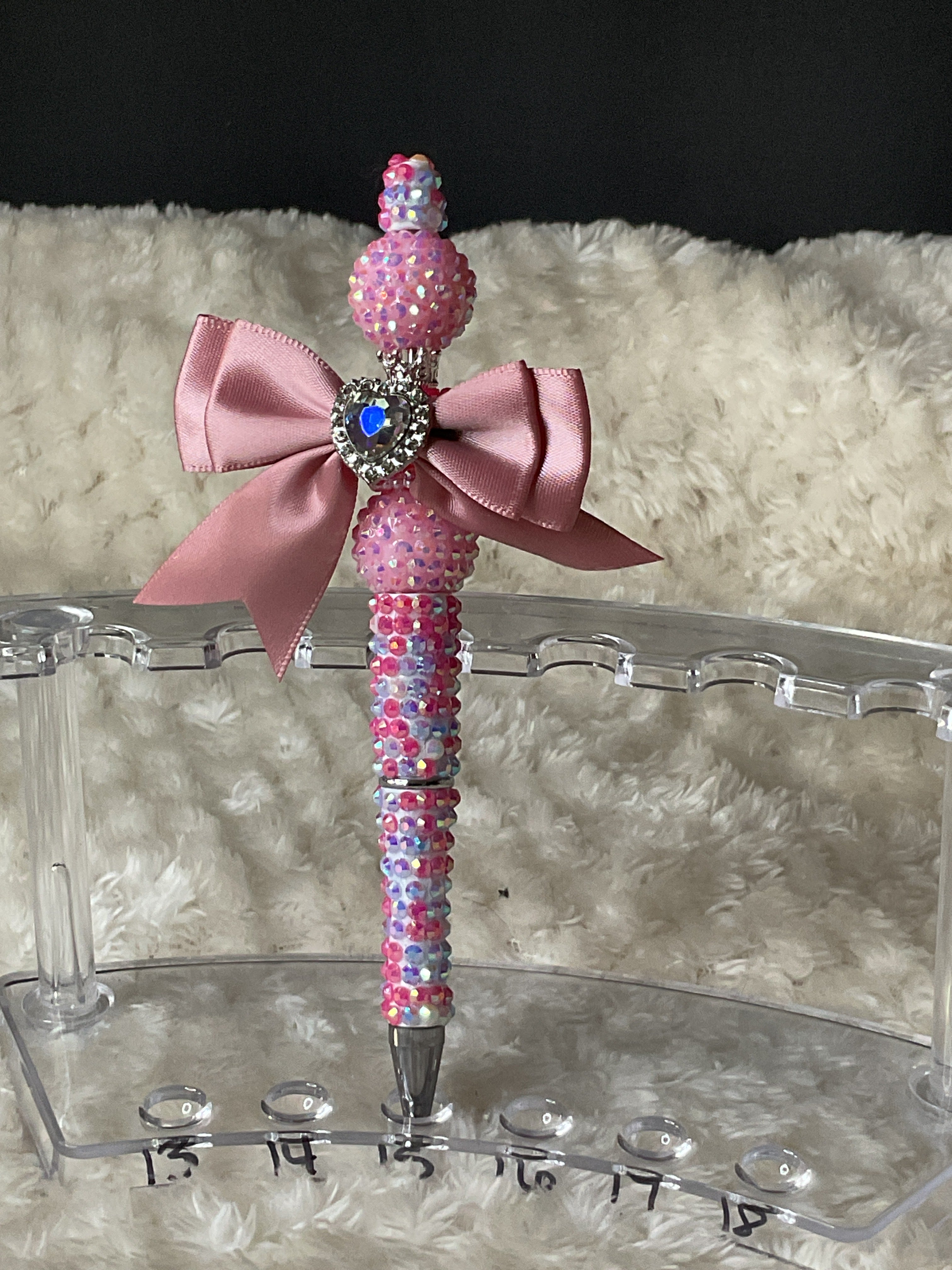 Pink and purple pen with a pink bow