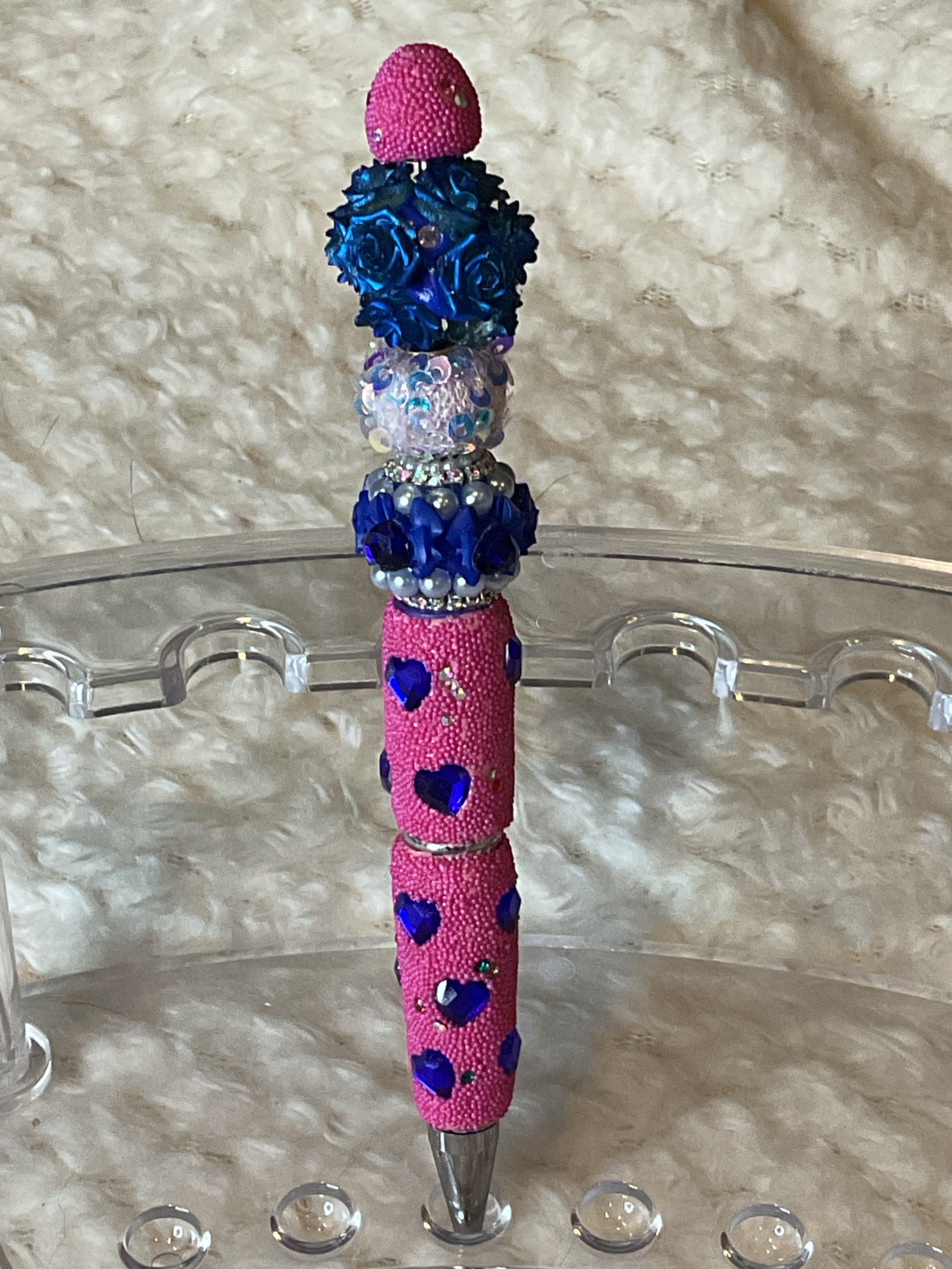 Pink with blue hearts, and blue floral beads