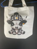 Black and white highland cow tote bag