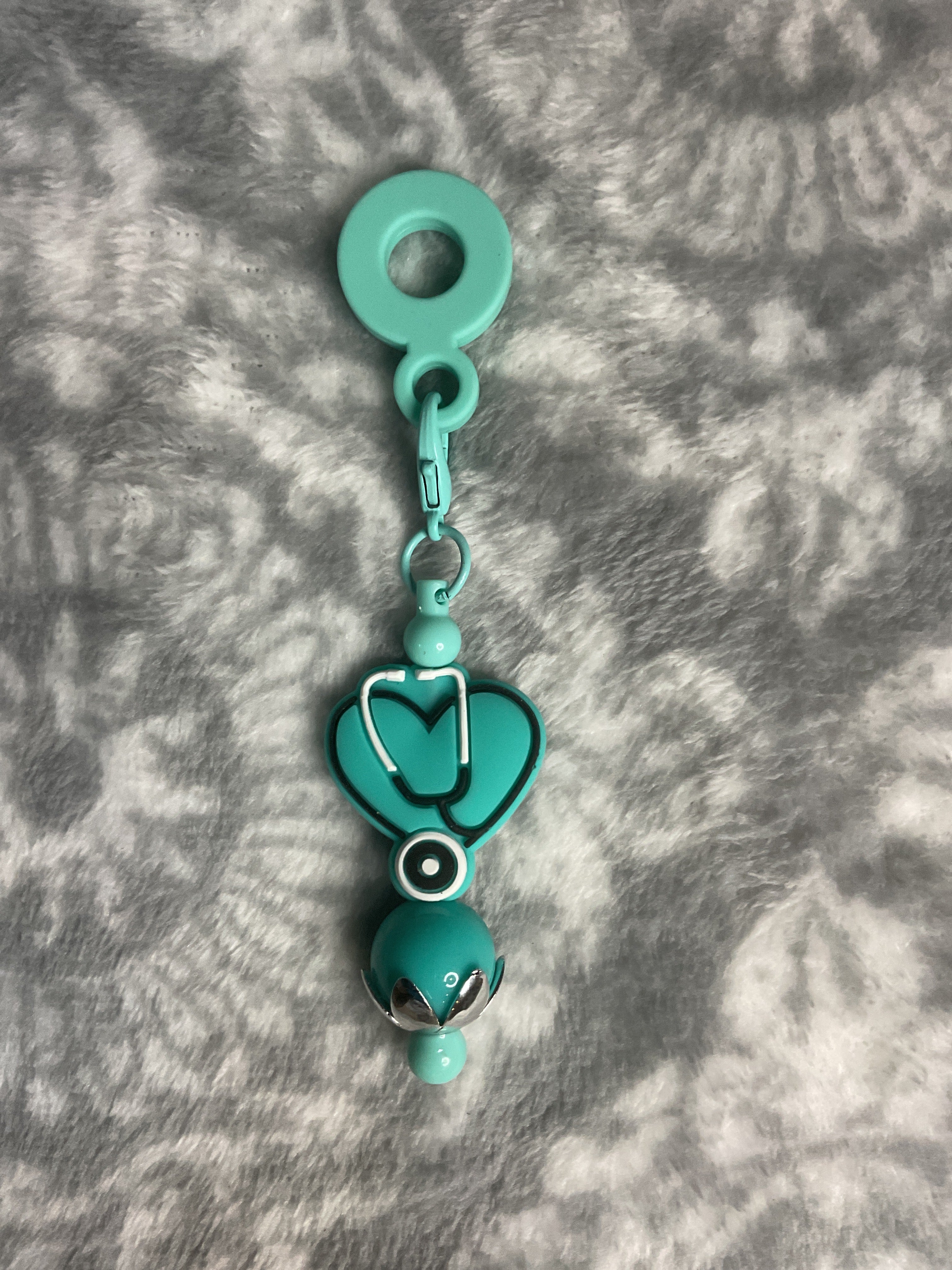 Teal nurse cub charm