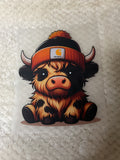 Brown with dark brown spots, Highland cow with Carhartt beanie