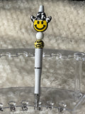 Smiley face with cow print, cowboy hat