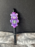 Purple bear on black pen