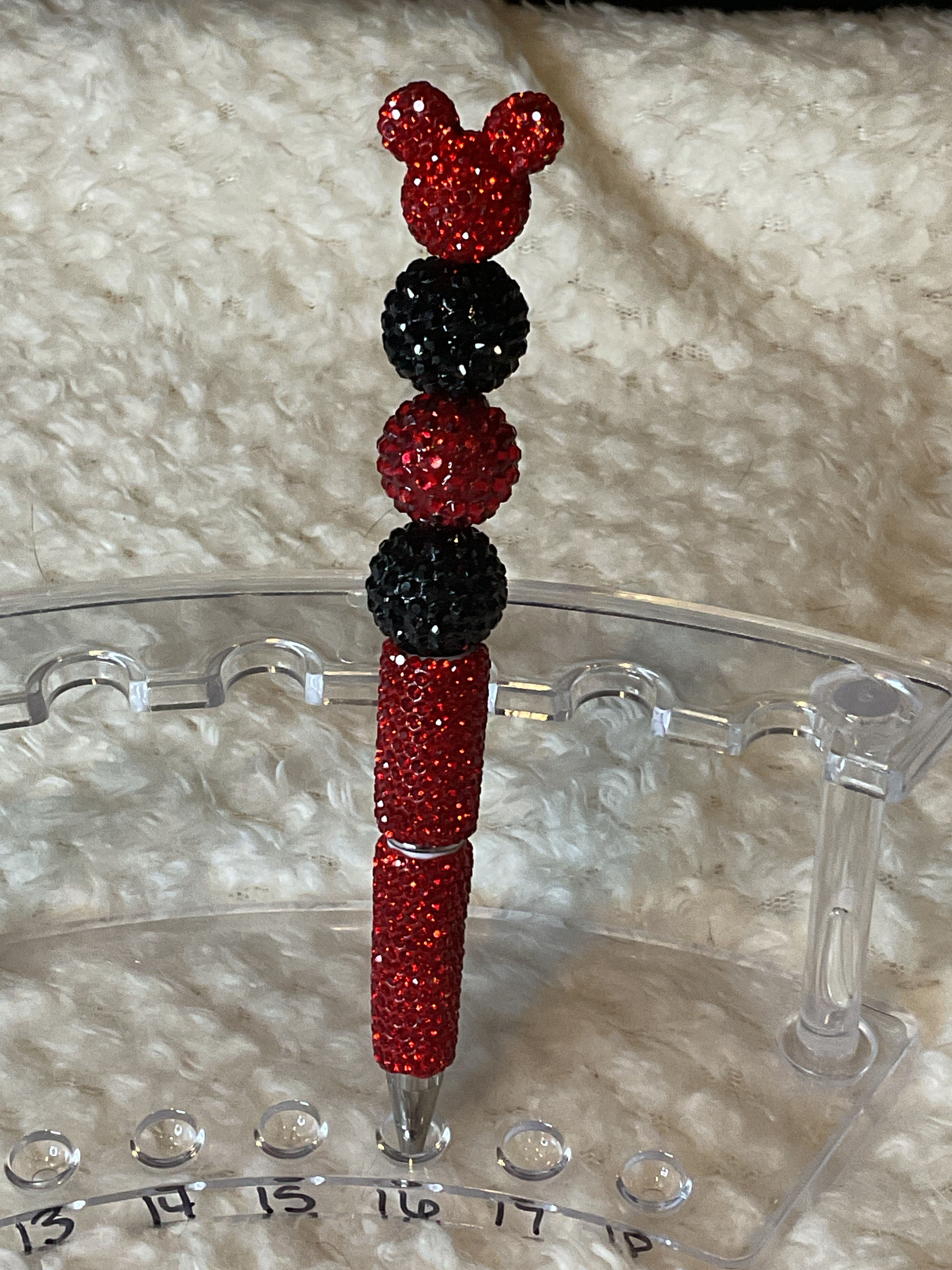 Red Mickey wants some pen with black and red
