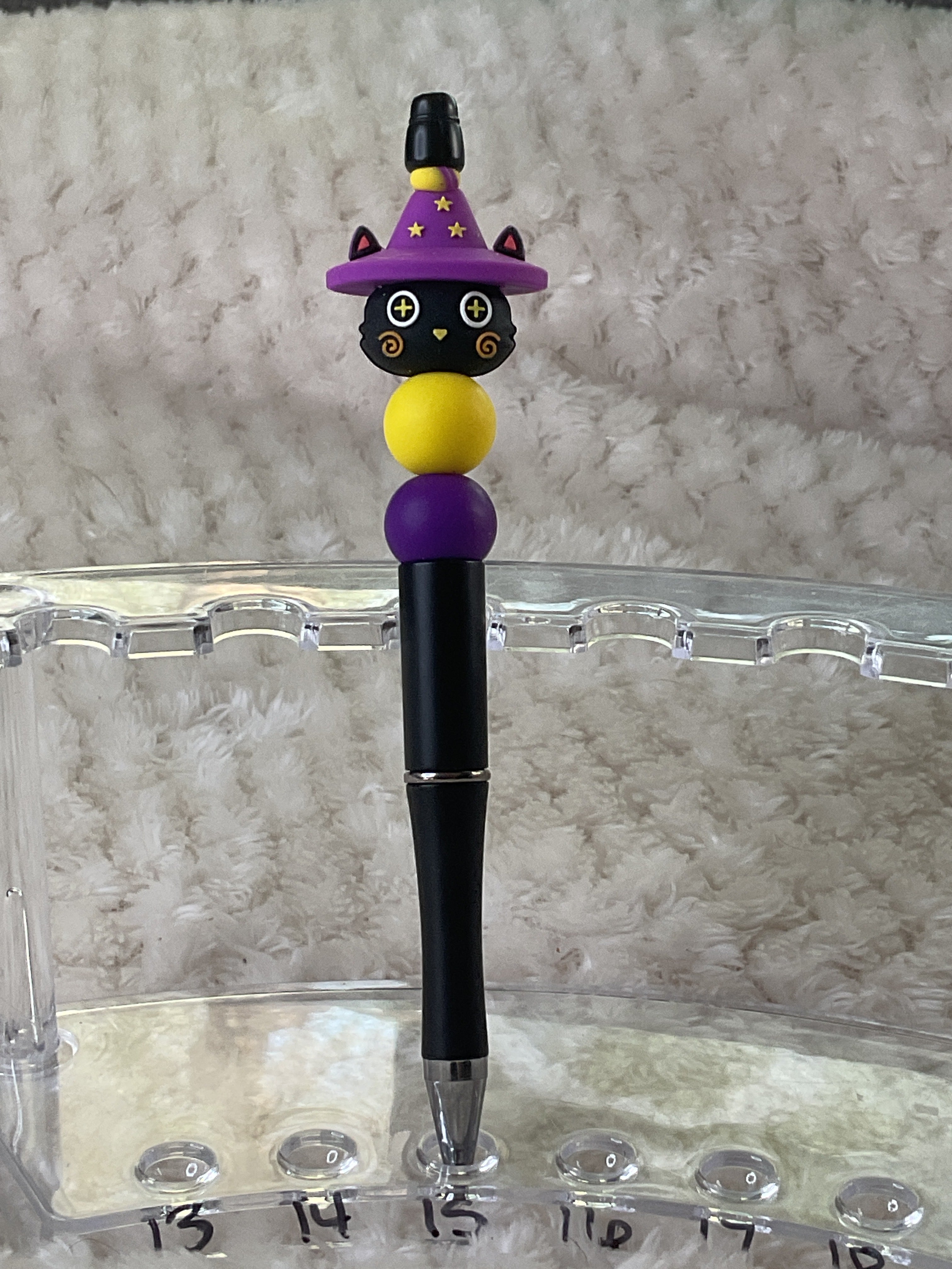 Cat in a purple hat