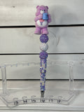 Share bear on purple and white rhinestone pen