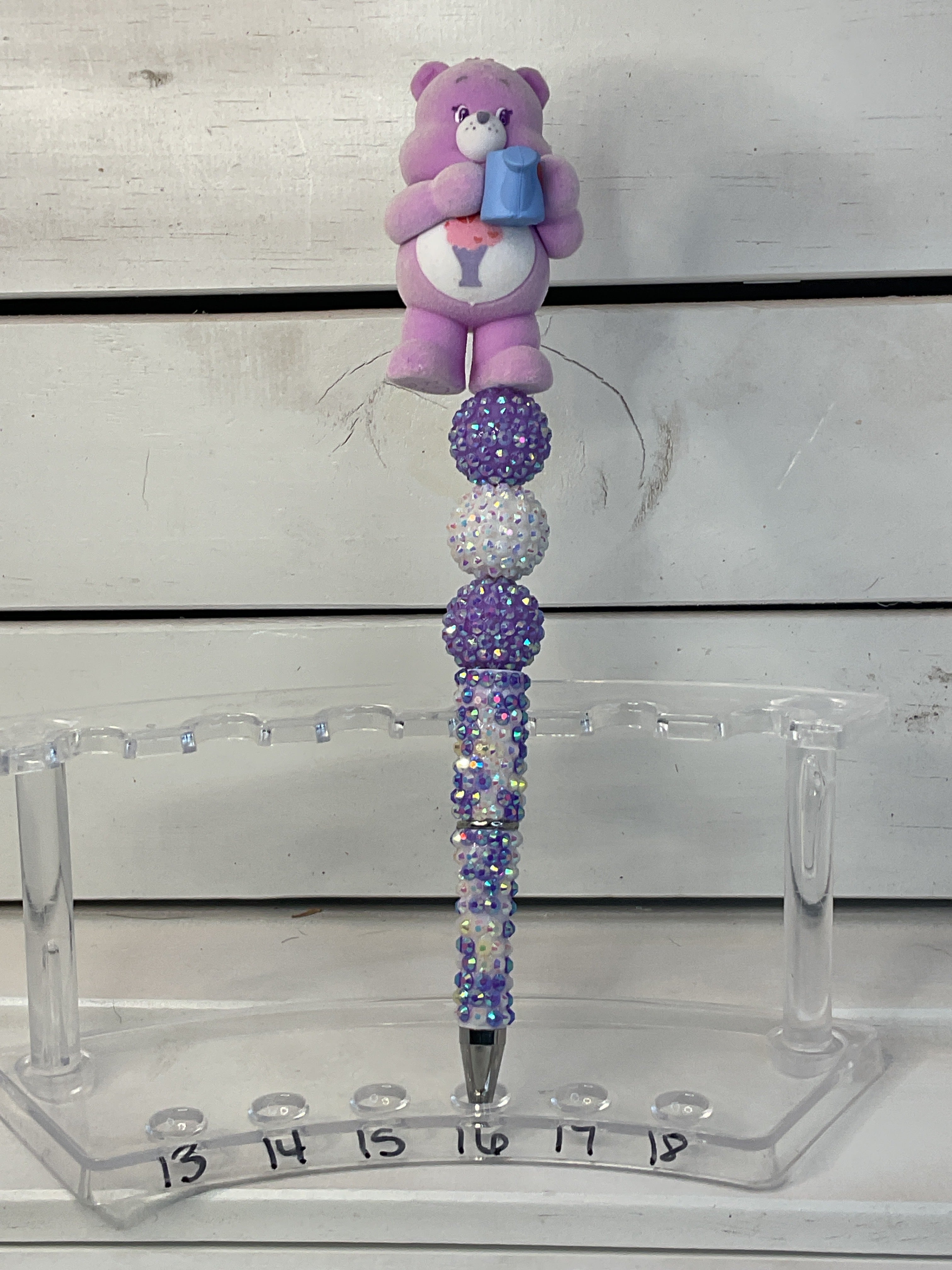 Share bear on purple and white rhinestone pen